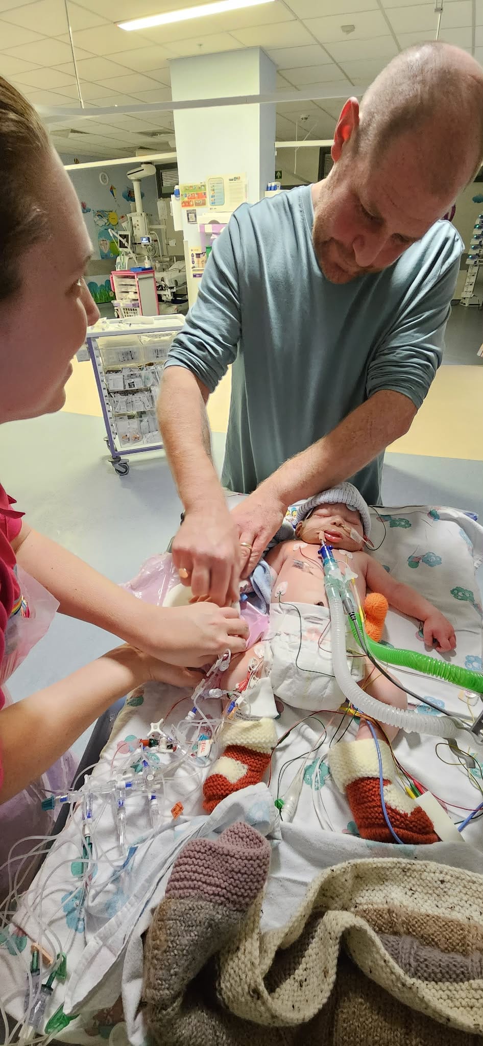 Archie with parents in hospital